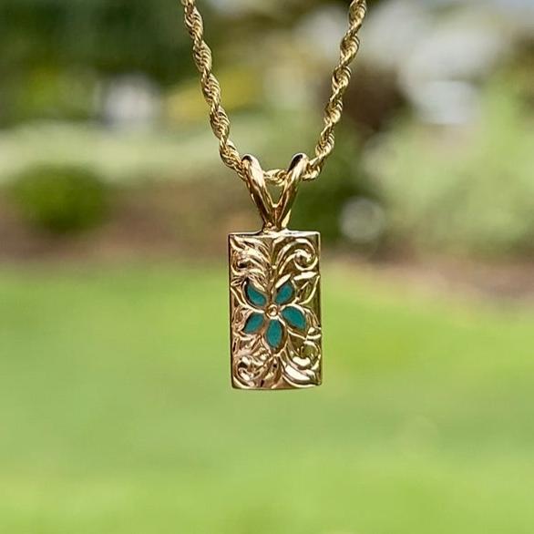 Hawaiian Puanani pendant with green enamel flower