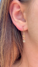 Load image into Gallery viewer, Model wearing Tri-Color Three Baby Plumerias Dangle Earrings in 14K Gold
